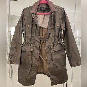 Jcrew rain/fall jacket. It’s a waxed material so good for weather. Size small